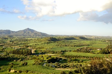 Green landscape of Stavrovouni mountain and cloudy sky