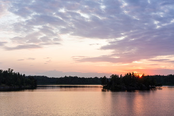 Fototapeta na wymiar sunset on a forest lake
