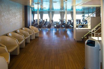 ferry inside. Empty seats without passengers.
 