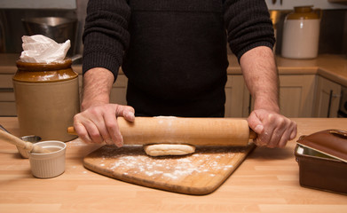 Cooking homemade puff pastry sausage rolls: rolling out pastry