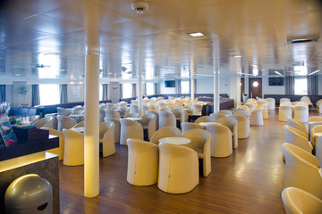 ferry inside. Empty seats without passengers.
 