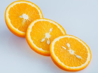 Sliced orange on a light blue background