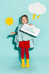 Little girl posing in fashion style wearing autumn clothing.