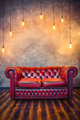 Red sofa couch in vintage room with lamps