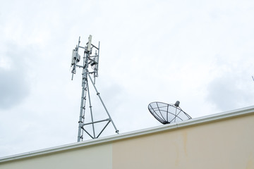 Antenna broadcasting tower on the rooftop of apartment