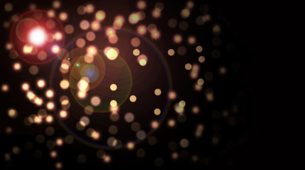 Gold Glitter Bokeh with Light Flare on dark background.