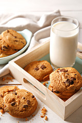 Cookies and milk on a wooden table