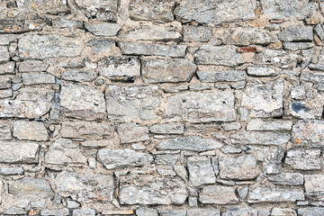 Background from a rough wall made of natural stone