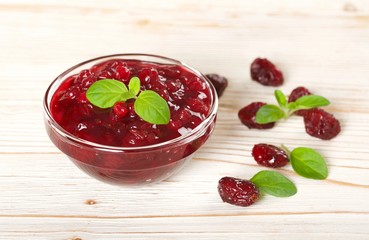 cranberries jam on a wooden background