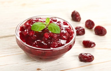 cranberries jam on a wooden background