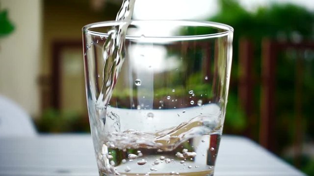Water glass in slow motion