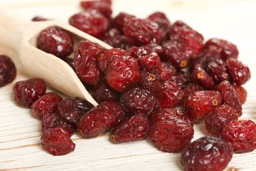 dried cranberries on a wooden background