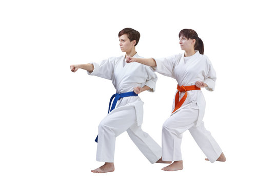 In karategi the sportswomen are beating punch arm