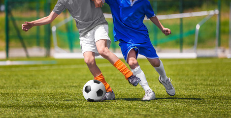 Obraz premium Football Soccer Match for Children. Kids Playing Soccer Game Tournament. Boys Running and Kicking Football on the Sports Grass Field