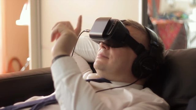 Businessman relax in VR headset in home