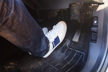 push the brake pedal of the car / brake the car