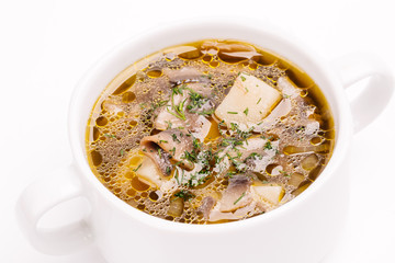 Mushroom soup in white bowl. Close-up view