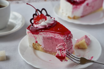 Delicious cake dessert with cream, cherry and coffee