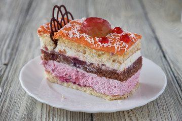 Delicious cake dessert with cream and fruit