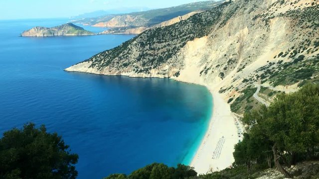 Tilt down from the Ionian sea to the bay of Myrtos on the Greek island of Kefalonia.