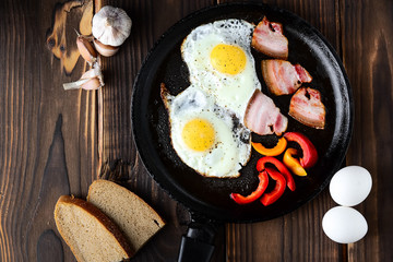 Fried eggs in a frying pan in a rural