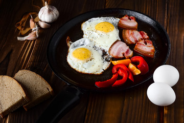 Fried eggs in a frying pan in a rural