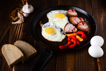 Fried eggs in a frying pan in a rural