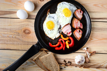 Fried eggs in a frying pan in a rural