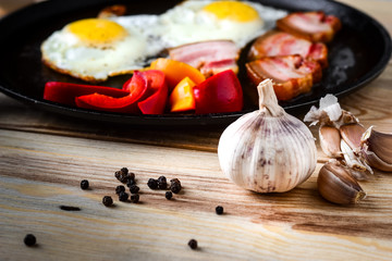 Fried eggs in a frying pan in a rural