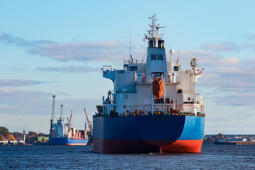Blue cargo ship entering the port of Riga, Europe