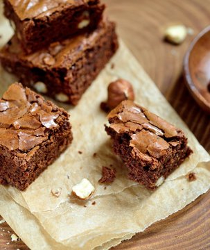 Сhocolate brownies with hazelnuts on the baking paper