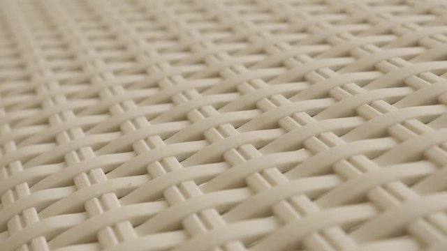 Decorative artificial rattan material furniture close-up 4K 2160p 30fps UltraHD panning footage - Plastic wicker beige color container texture slow pan 3840X2160 UHD video 