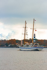 Fototapeta premium White sailing ship coming from Baltic sea and entering Riga