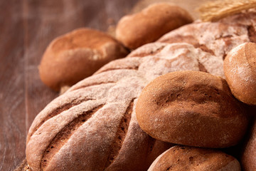 Assortement of fresh bread on the wooden table