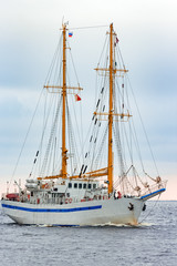 Fototapeta na wymiar White sailing ship coming from Baltic sea, Europe