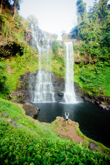 Winner near waterfall. Active life concept