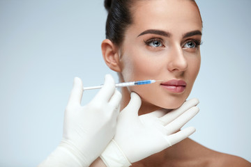 Plastic Surgery. Beautiful Woman Face Getting Beauty Injections