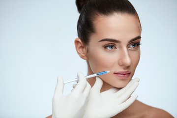 Plastic Surgery. Beautiful Woman Face Getting Beauty Injections