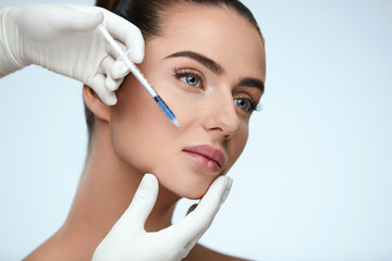 Plastic Surgery. Beautiful Woman Face Getting Beauty Injections
