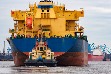 Blue cargo ship entering the port of Riga, Europe