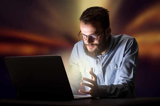 Businessman in the office at night