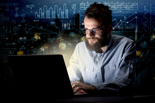 Businessman in the office at night