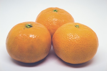 Matte Closeup of Three Clementines