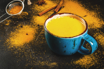 Traditional Indian drink turmeric milk is golden milk with cinnamon, cloves, pepper and turmeric....