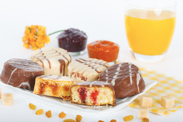 Homemade chocolate and vanilla Sponge cake with jam and orange juice