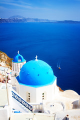 traditional blue dome of church with bellfry, Oia, Santorini, retro toned