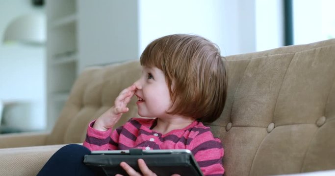Child using tablet in modern apartment