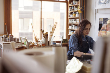 Female artist working in workshop