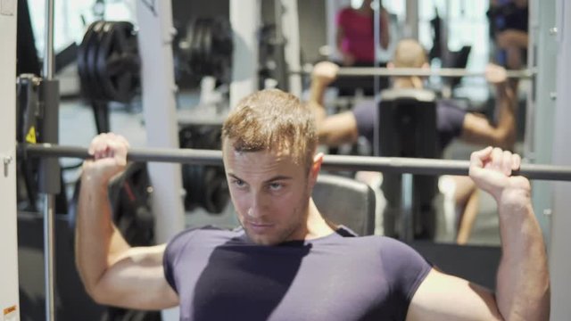 A young man is training in the gym. 4K