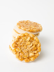 Sweet cookies with caramelized peanuts on white